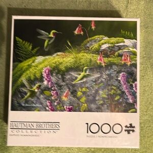 Brand new, unopened 1000 piece hummingbird scene puzzle.